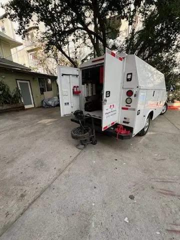 Magnet Plumbing service vehicle on-site for Grease Trap Cleaning in Palm Bay